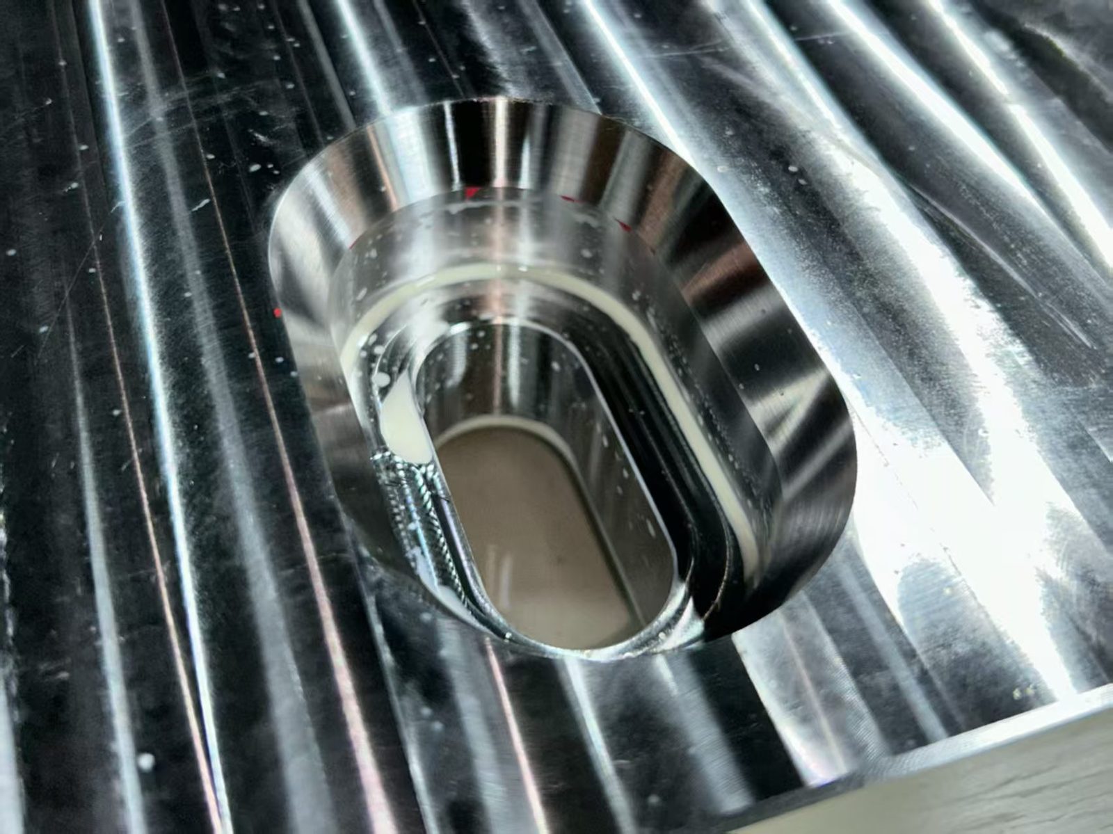 Same precision CNC machined component shown from a second angle
