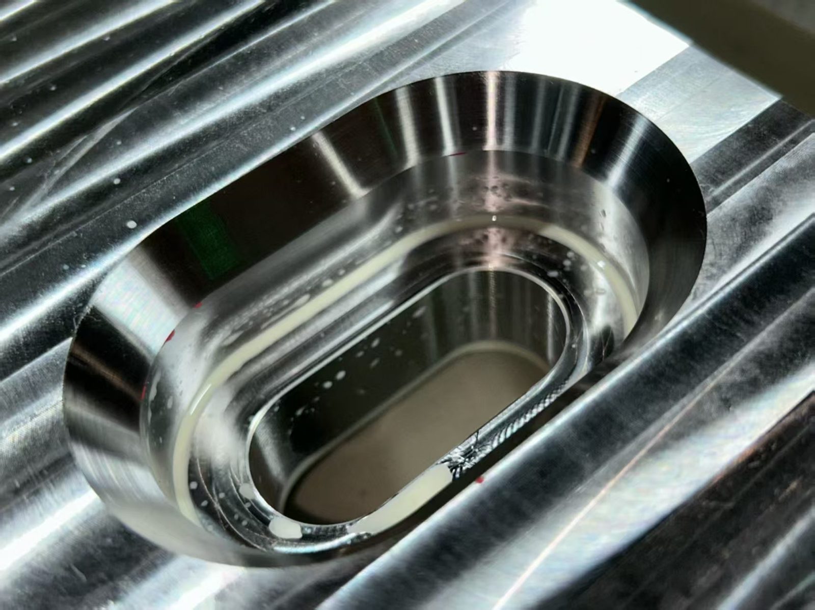 Precision-machined metal component with clean internal bore and high surface finish